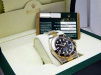 Rolex - Montre Rolex Submariner Date Cramique, or et acier, rf: 116613 LN en tres bon etat
